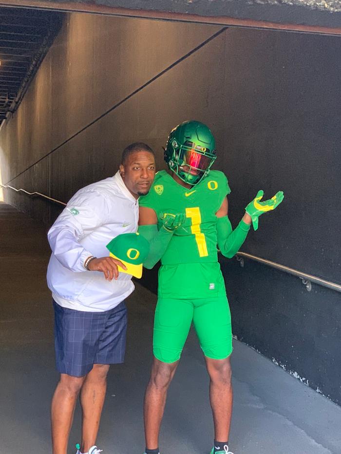 Stephon Johnson Jr. poses with Oregon Wide Receivers Coach Bryan McClendon on his official visit.
