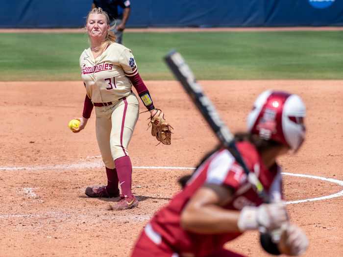 Jun 10, 2021; Oklahoma City, Oklahoma, USA; Florida State Seminoles starting pitcher/relief pitcher Danielle Watson (31) pitches to Oklahoma Sooners during the third inning during game three of the NCAA Womens College World Series Championship Series at USA Softball Hall of Fame Stadium.