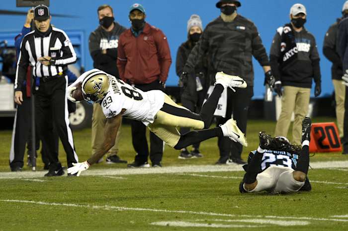 New Orleans receiver Juwan Johnson (83) makes a catch in the fourth quarter at Bank of America Stadium. Mandatory Credit: Bob Donnan-USA TODAY Sports