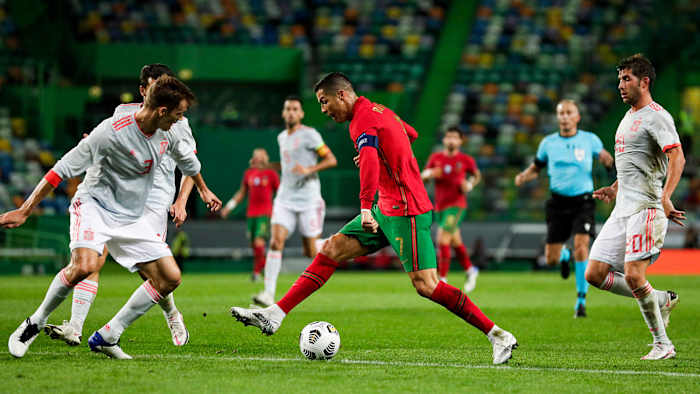 Cristiano Ronaldo dribbles at the Spain defense in a pre-Euro 2020 friendly.