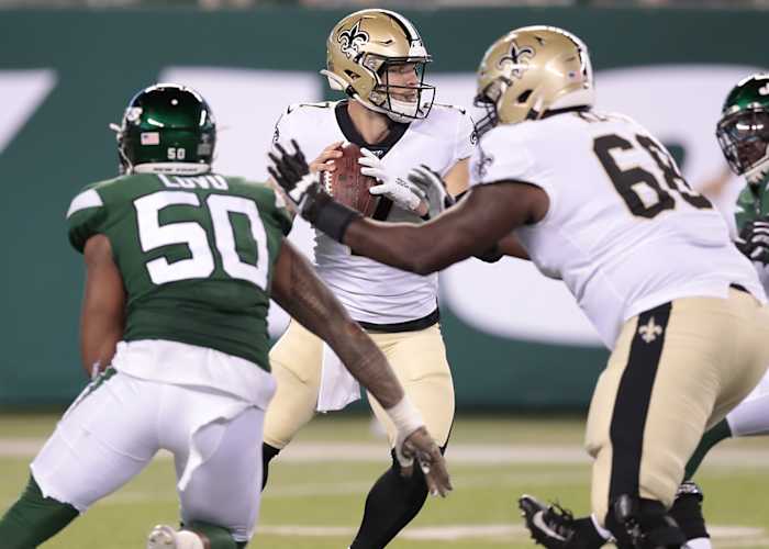 Saints quarterback Taysom Hill (7) drops back to pass as Jets linebacker Frankie Luvu (50) is blocked by tackle Derrick Kelly (68). Mandatory Credit: Vincent Carchietta-USA TODAY