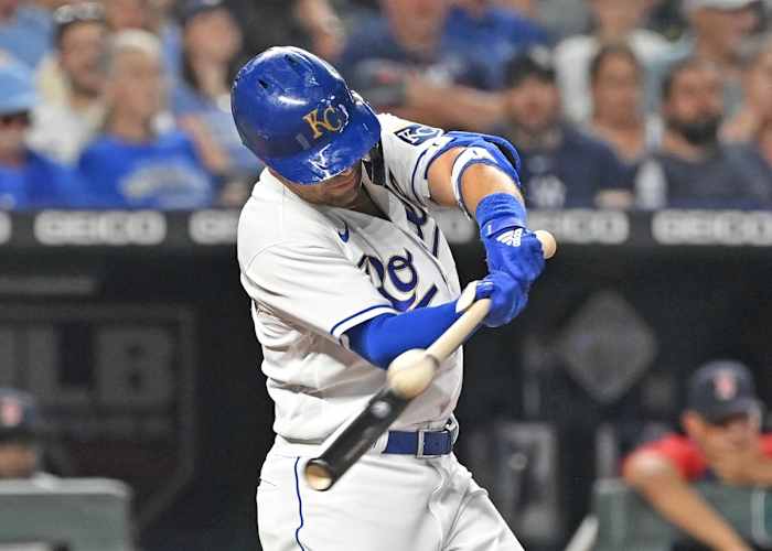 Jun 18, 2021; Kansas City, Missouri, USA; Kansas City Royals right fielder Whit Merrifield (15) hits an RBI double during the sixth inning against the Boston Red Sox at Kauffman Stadium. Mandatory Credit: Peter Aiken-USA TODAY Sports