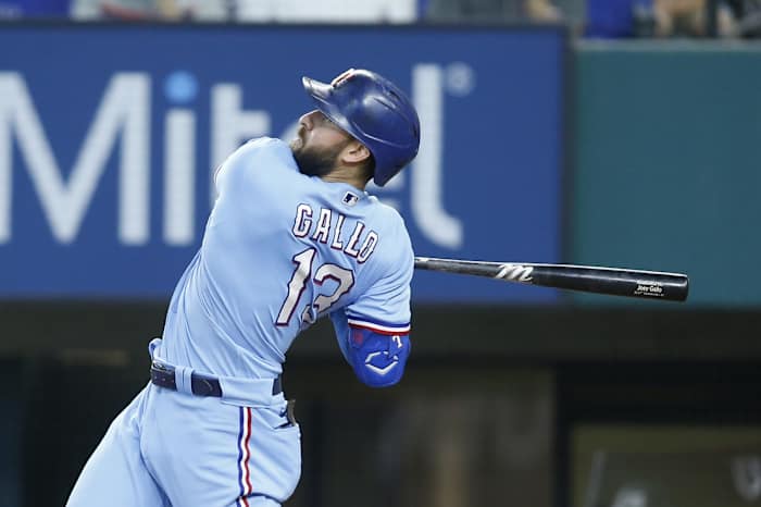 Jun 20, 2021; Arlington, Texas, USA; Texas Rangers right fielder Joey Gallo (13) follows through on a swing for a home run in the sixth inning against the Minnesota Twins at Globe Life Field.