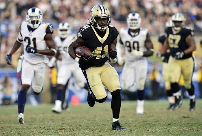 New Orleans Saints running back Alvin Kamara (41) runs against the Los Angeles Rams defense. Mandatory Credit: Gary A. Vasquez-USA TODAY