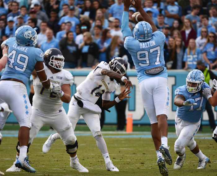 North Carolina Tar Heels defensive tackle Jalen Dalton (97) knocks down the pass of Western Carolina quarterback Tyrie Adams (12). Mandatory Credit: Rob Kinnan-USA TODAY Sports