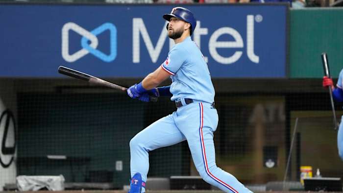 Jun 27, 2021; Arlington, Texas, USA; Texas Rangers right fielder Joey Gallo (13) hits a two run home run against the Kansas City Royals during the first inning of a baseball game at Globe Life Field.