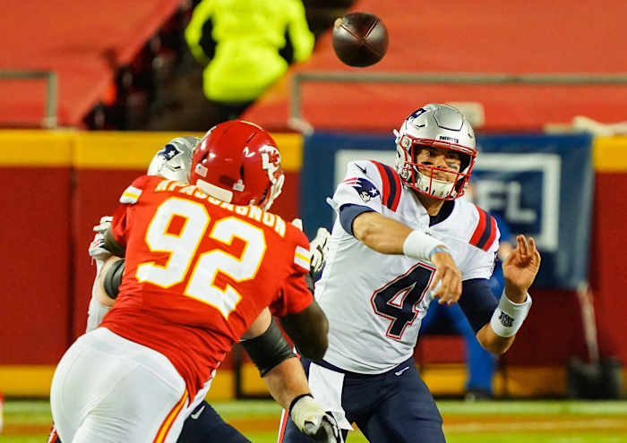 New England quarterback Jarrett Stidham (4) throws a pass as Chiefs defensive end Tanoh Kpassagnon (92) defends. Mandatory Credit: Jay Biggerstaff-USA TODAY
