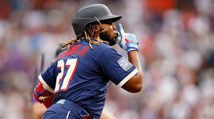 Jul 13, 2021; Denver, Colorado, USA; American League first baseman Vladimir Guerrero Jr. of the Toronto Blue Jays (27) celebrates as he rounds the bases after hitting a home run against the National League during the third inning during the 2021 MLB All Star Game at Coors Field.