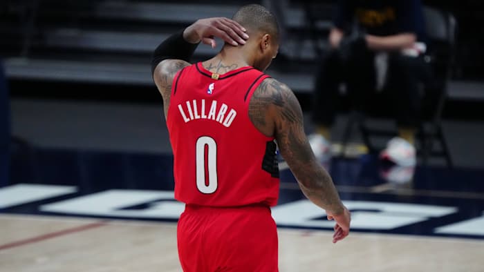 Portland Trail Blazers guard Damian Lillard (0) leaves the court after a double overtime loss to Denver Nuggets during game five in the first round of the 2021 NBA Playoffs. at Ball Arena.