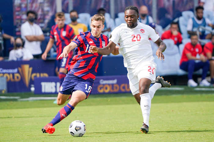 USA's James Sands and Canada's Ayo Akinola at the Concacaf Gold Cup