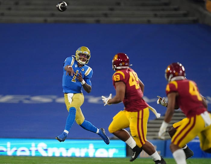 Dorian Thompson-Robinson lets a pass fly against USC in the 2020 victory bell game.