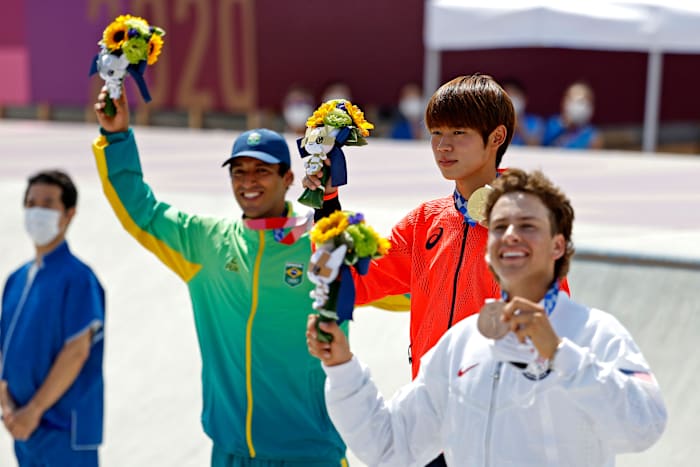 Brazil's Kelvin Hoefler with gold medalist Yuto Horigome of Japan and silver medalist Jagger Eaton of the U.S.