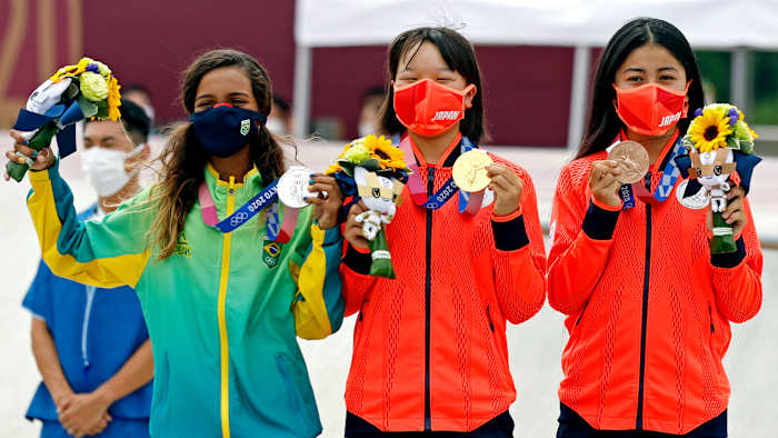 Rayssa Leal (BRA), silver; Momiji Nishiya (JPN), gold; and Funa Nakayama (JPN), bronze; celebrate with their medals in the women's street skateboard during the Tokyo 2020 Olympic Summer Games.