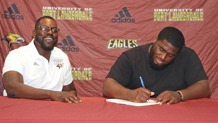 Chris Chambers with a Fort Lauderdale signee