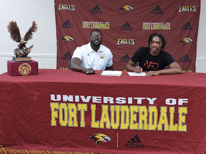 Fort Lauderdale coach Chris Chambers with a signee