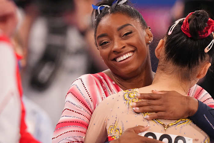 Simone Biles hugging a competitor