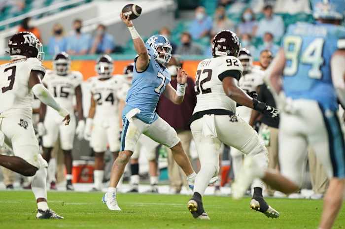 Jan 2, 2021; Miami Gardens, FL, USA; North Carolina Tar Heels quarterback Sam Howell (7) gets off a pass against the Texas A&M Aggies during the second half at Hard Rock Stadium.