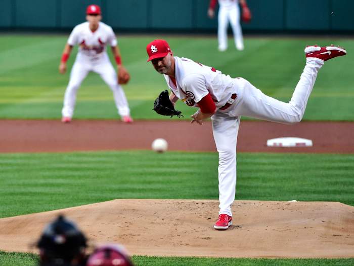 Aug 4, 2021; St. Louis, Missouri, USA; St. Louis Cardinals starting pitcher J.A. Happ (34) pitches to Atlanta Braves right fielder Jorge Soler (12) during the first inning at Busch Stadium.