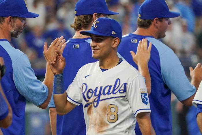 Jul 16, 2021; Kansas City, Missouri, USA; Kansas City Royals shortstop Nicky Lopez (8) is congratulated after the game against the Baltimore Orioles at Kauffman Stadium. Mandatory Credit: Denny Medley-USA TODAY Sports