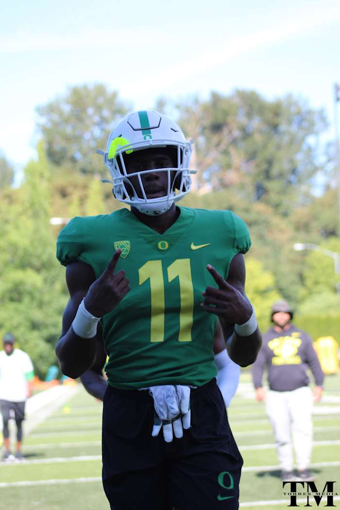 Bridges goes through warmups at Oregon fall camp.