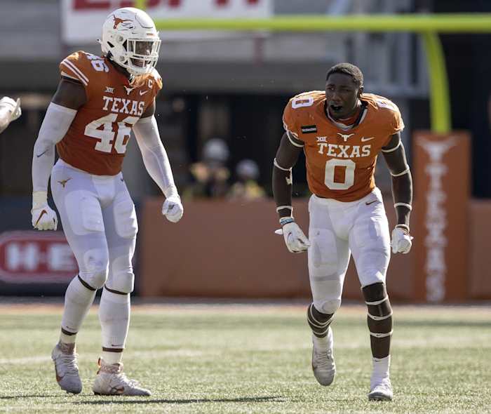 Nov 7, 2020; Austin, Texas, USA; Texas linebacker DeMarvion Overshown, right, celebrates with Texas linebacker Joseph Ossai after Overshown sacked West Virginia quarterback Jarret Doege in the third quarter at Royal-Memorial Stadium on Saturday November 7, 2020. Mandatory Credit: Jay Janner-USA TODAY NETWORK