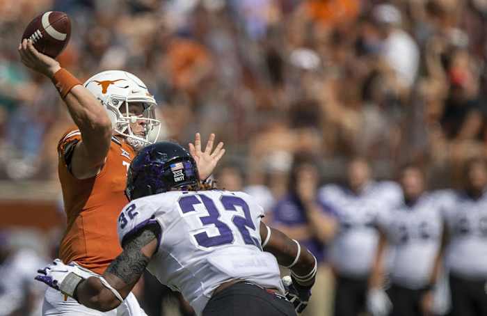 Oct 3, 2020; Austin, TX, USA; TCU Horned Frogs defensive end Ochaun Mathis (32) pressures Texas Longhorns quarterback Sam Ehlinger (11) in the 3rd quarter in a NCAA college football game at Darrell K Royal-Texas Memorial Stadium.
