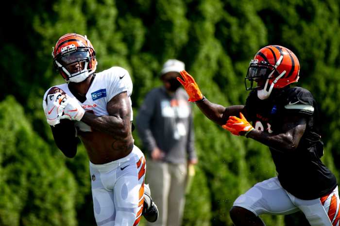 Cincinnati Bengals wide receiver Ja'Marr Chase (1) catches a pass as Cincinnati Bengals cornerback Mike Hilton (21) defends during Cincinnati Bengals practice on Thursday, Aug. 26, 2021