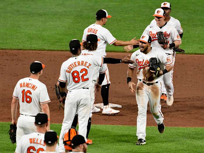 Aug 25, 2021; Baltimore, Maryland, USA; Baltimore Orioles right fielder Anthony Santander (25) celebrates with teammates after beating against the Los Angeles Angels ending their 19 game loosing streak. at Oriole Park at Camden Yards.