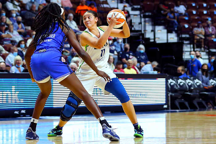 Natalie Achonwa holds a basketball