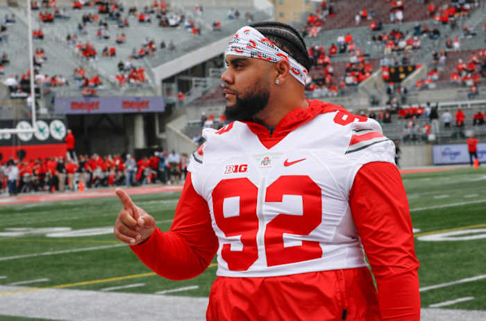 Ohio State defensive tackle Haskell Garrett has struck a marketing deal with Heartland BancCorp under new rules that allow college athletes to profit from their names, images and likenesses. O