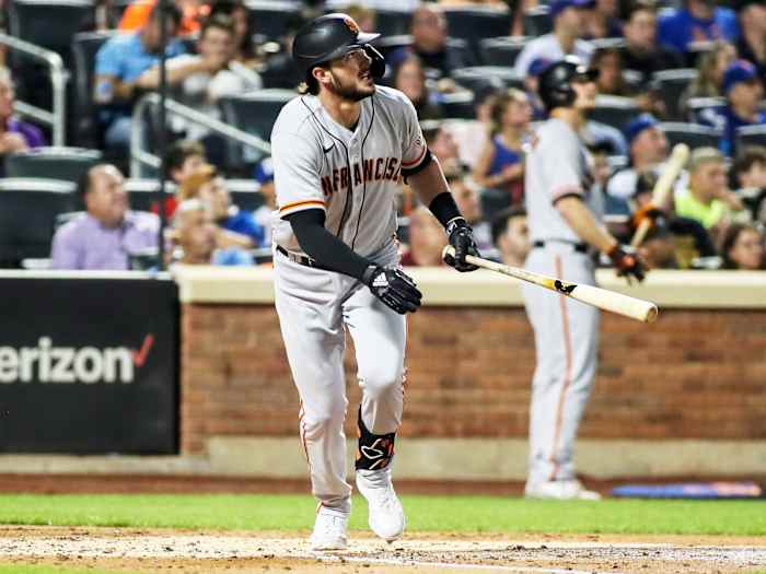 Aug 25, 2021; New York City, New York, USA;  San Francisco Giants third baseman Kris Bryant (23) hits a solo home run in the fourth inning against the New York Mets at Citi Field.