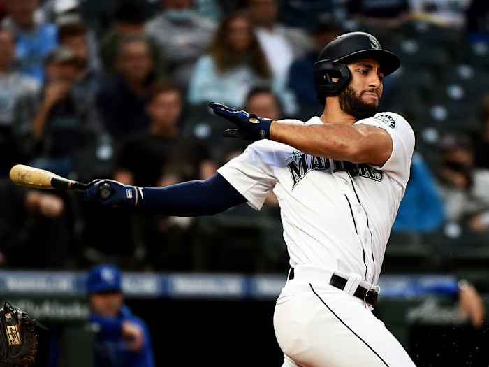 Aug 26, 2021; Seattle, Washington, USA; Seattle Mariners second baseman Abraham Toro hits a base hit against the Kansas City Royals at T-Mobile Park.
