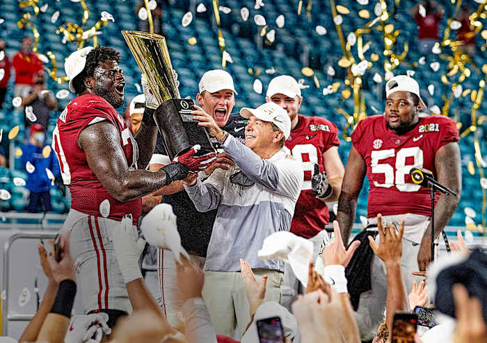 Nick Saban lifts the 2020 championship trophy for Alabama