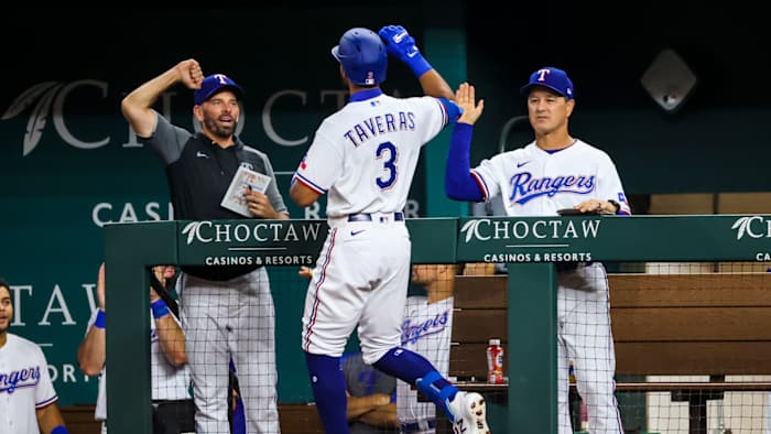 Aug 30, 2021; Arlington, Texas, USA; Texas Rangers center fielder Leody Taveras (3) celebrates with coaches after hitting a home run during the fifth inning against the Colorado Rockies at Globe Life Field.