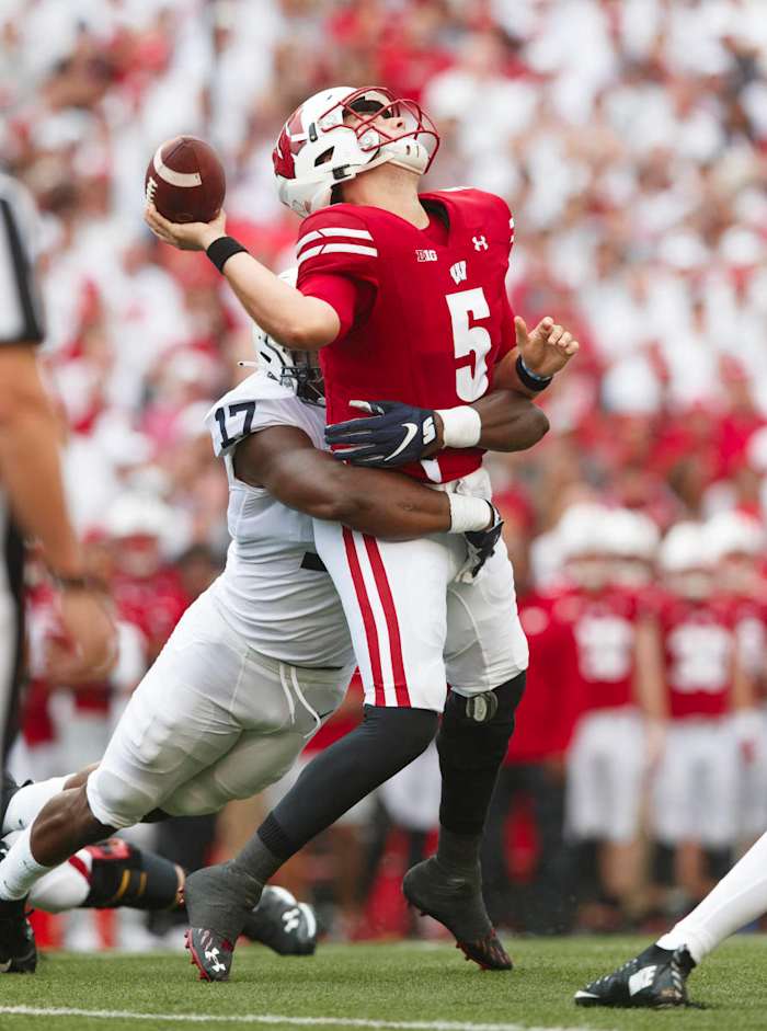 Penn State's Arnold Ebiketie hits Wisconsin quarterback Graham Mertz (Jeff Hanisch/USA Today Sports)