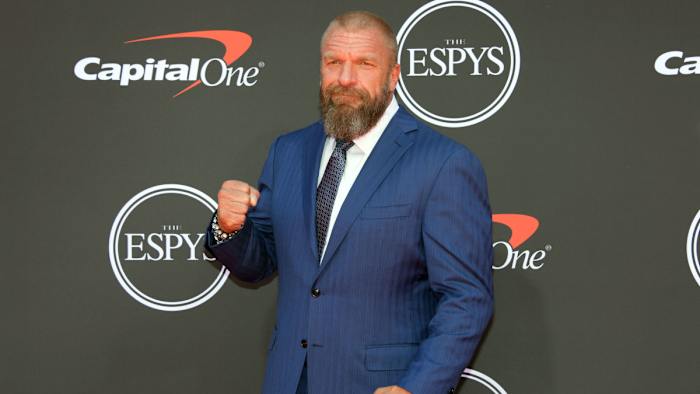 WWE personality Triple H arrives on the red carpet at Microsoft Theatre.