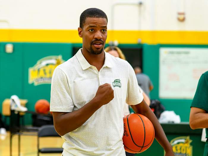 George Mason coach Kim English instructs during practice