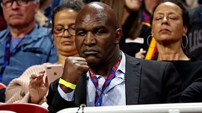 Why is Evander Holyfield back in the ring at 58 years old?