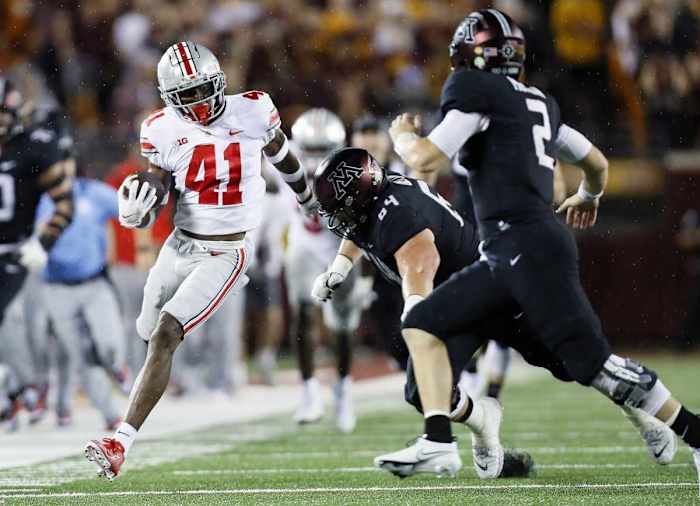 Josh Proctor (41) returns an interception against the Minnesota Golden Gophers.