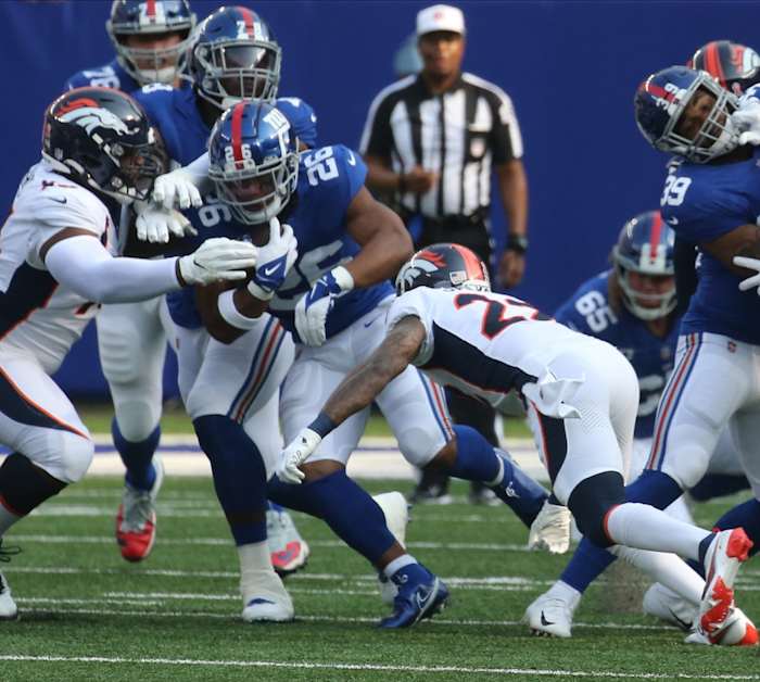 Saquon Barkley of the Giants runs the ball in the first half as the Denver Broncos came to MetLife Stadium in East Rutherford, NJ to play the New York Giants in the first game of the 2021 season on September 12, 2021.
