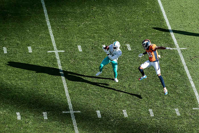 Xavien Howard steps in front of Broncos receiver Tim Patrick to intercept a pass during a 2020 game