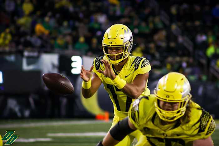 Thompson takes a snap against Stony Brook in his first collegiate action. 