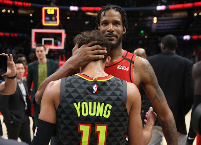 Portland Trail Blazers forward Trevor Ariza (8) greets Atlanta Hawks guard Trae Young (11) after their game at State Farm Arena.