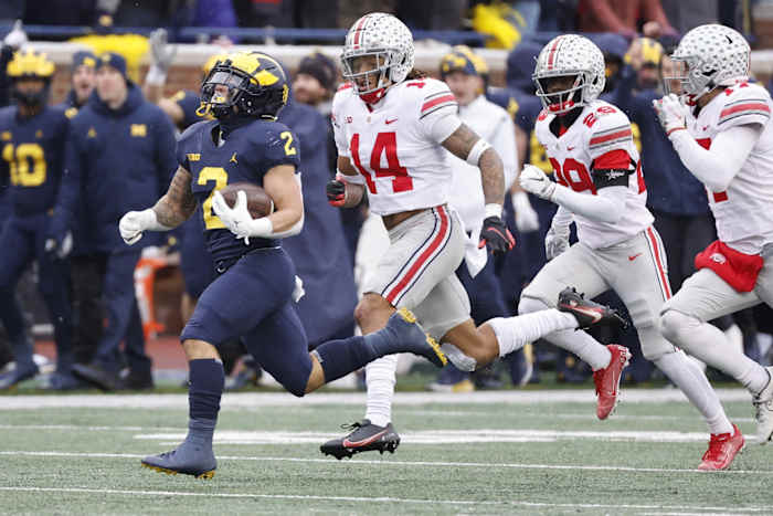 Michigan’s Blake Corum runs past Ohio State