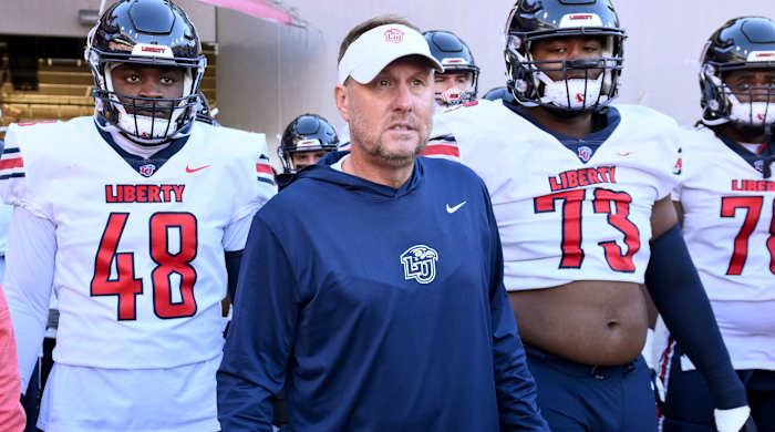Liberty head coach Hugh Freeze gets ready to take the field with his players.
