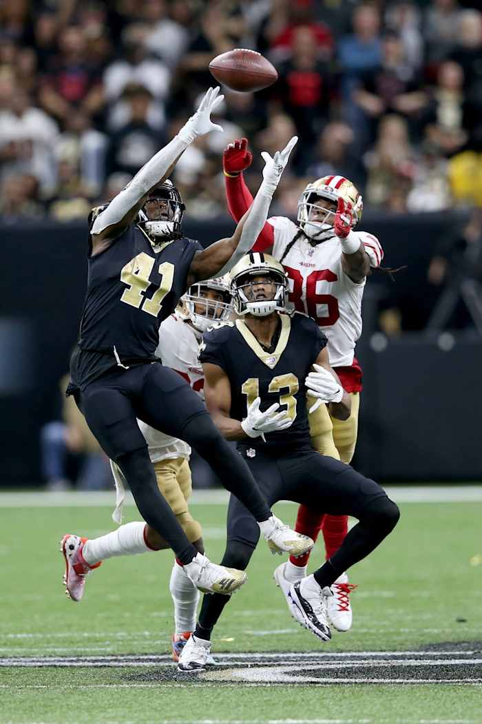Dec 8, 2019; New Orleans Saints running back Alvin Kamara (41) and wide receiver Michael Thomas (13) reaches for a pass against the San Francisco 49ers. Mandatory Credit: Chuck Cook-USA TODAY