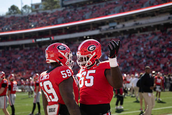 OTs Broderick Jones and Amarius Mims