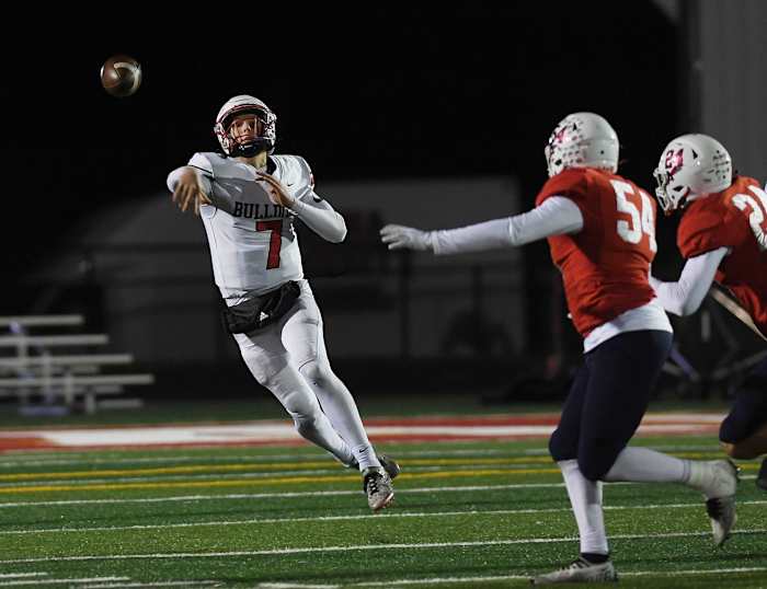 Algona High School quarterback Alex Manske throwing the football in a game against Ballard.