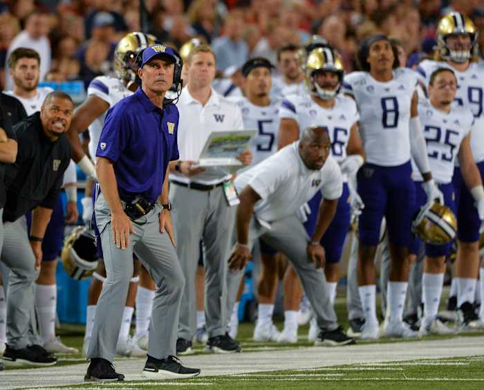 Tucson, AZ, USA; Washington Huskies head coach Chris Petersen looks to the scoreboard during the second half against the Arizona Wildcats at Arizona Stadium.