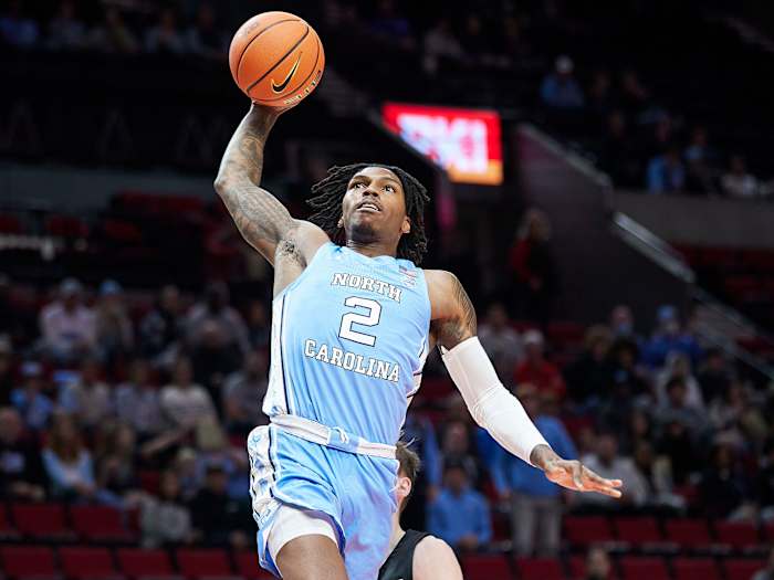 UNC’s Caleb Love goes up for a dunk